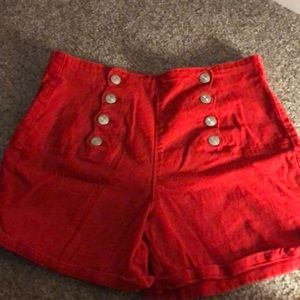 red shorts with 4 buttons